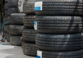 New and used car tyres shown at a tyre shop.