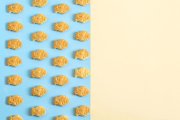 Cookies in form of small fish on blue background