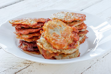 fresh homemade potato pancakes on a plate close-up