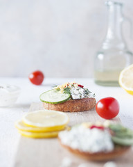 Top view of Healthy Sandwich toast with lettuce, ham, cheese and tomato on a wooden background
