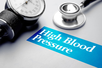 High Blood Pressure, medical concept. Blood pressure meter and stethoscope on grey background. Selective focus image.