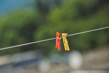 wedding rings on clothespins on the rope