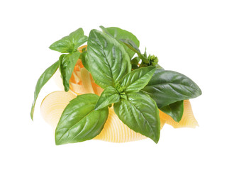 Fresh basil on pasta, isolated white background