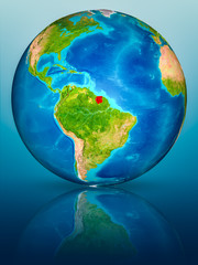 Suriname on Earth on reflective surface