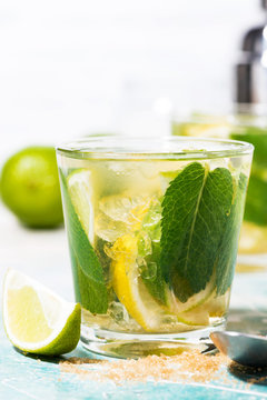 fresh cold mojito cocktail, vertical closeup