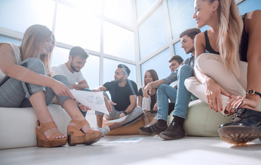 group of initiative young people listen to their leader