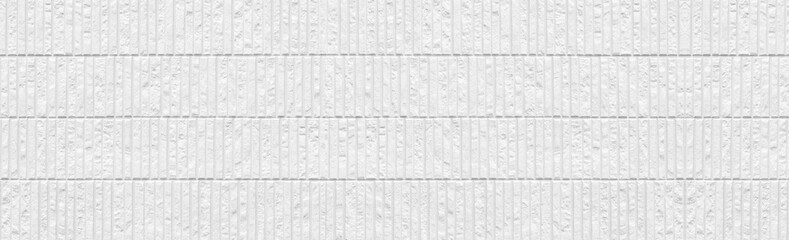 Fototapeta premium Panorama of Modern white stone tile wall background and pattern