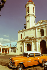 Old cars parked in the José Martí Park, in front of the Purisima Concepcion Cathedral. Cienfuegos, Cuba.