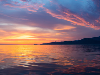 Beautiful sunset in Adriatic sea, Montenegro, captured from a sailing boat