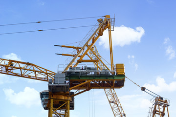 Fototapeta na wymiar Tower crane with blue sky background