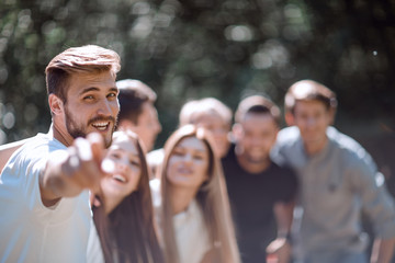 group of friends pointing at you