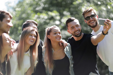 group of friends taking selfies in the Park