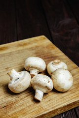 champignons on a wooden background