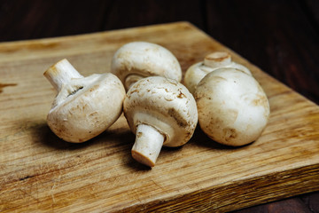 champignons on a wooden background