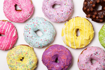 Many donuts on a white background top view