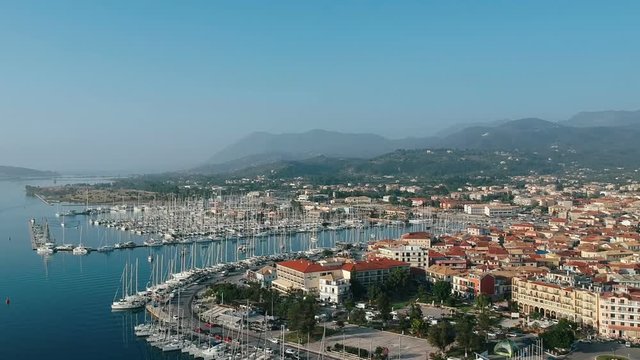 Aerial view of Lefkas harbour. Yacht and sailboats moored at the quay. 