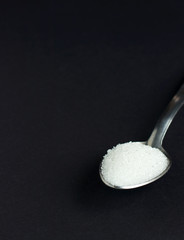 sugar on black background