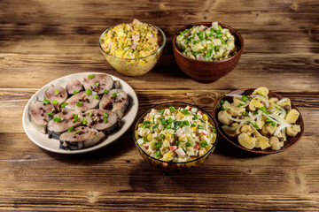 Various festive dishes on wooden table