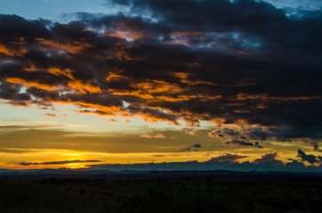 Impressive sunset with storm clouds towering in distance in northern Angola, Africa