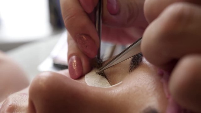 gluing eyelashes macro