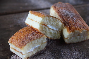 fresh sweet homemade delicious cake on wooden background