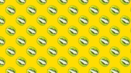 A seamless pattern with green kiwi on a yellow background