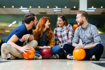 Fototapeta premium Friends enjoying bowling at club