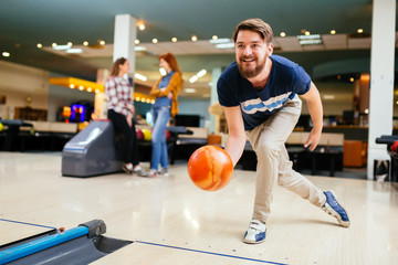 Handsome man bowling