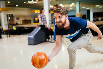 Handsome man bowling