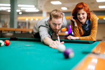 Couple dating and playing snooker