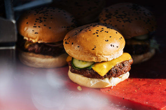 Delicious juicy burgers on counter