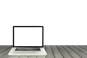 Laptop with white screen on wooden floor isolated in white background