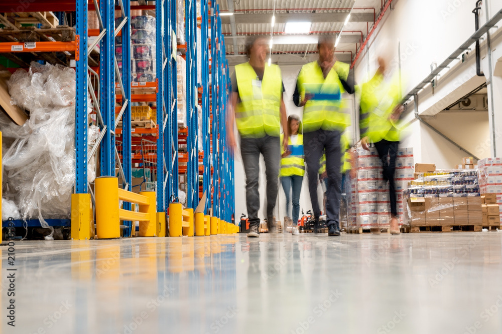 Wall mural workers in warehouse blurred