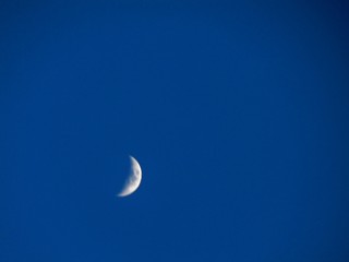Obraz na płótnie Canvas Crescent Moon in Blue Sky