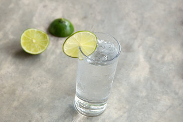 Glass of fresh drinking water with slice of lime