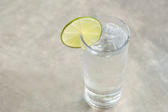 Glass of fresh drinking water with slice of lime