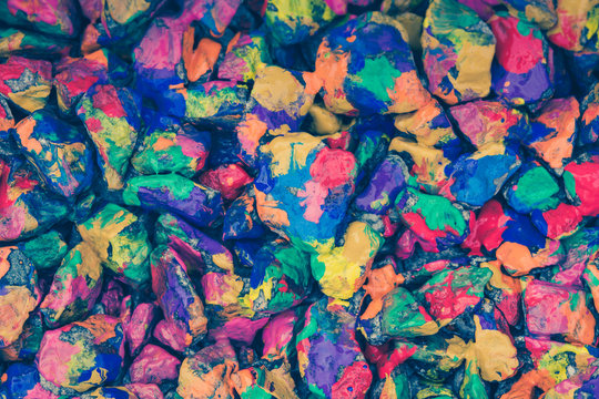 beautiful abstract background of stones covered with multi-colored paint