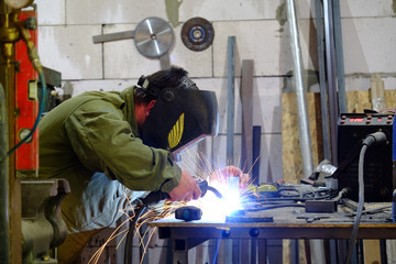 welder on the work place, home welding