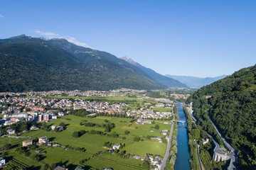 Fototapeta na wymiar Adda river and city of Morbegno. Valtellina. Aerial shot