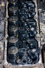 Obraz na płótnie Canvas Details of a dirty diesel engine under the hood of car