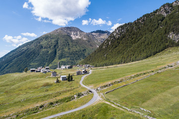 Valtellina, road and small village in mountain. Village of Eita in Valgrosina