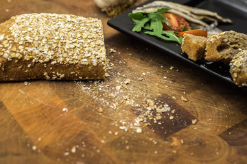 Plate of anchovies with tomatoes and homemade bread