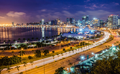 Skyline of capital city Luanda, Luanda bay and seaside promenade with highway during afternoon,...