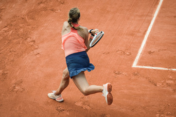 Backhand swing of woman playing tennis