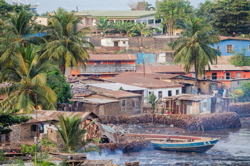 View over slums of Freetown at the sea where the poor inhabitants of this African capital city...