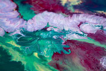 Fototapeta na wymiar abstraction of the flowing multi-colored acrylic