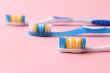 toothbrushes on a colored background top view. oral health, brush your teeth, healthy teeth