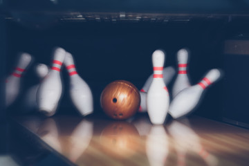 motion blur of bowling ball skittles on the playing field - obrazy, fototapety, plakaty