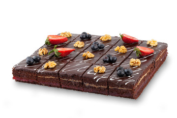 Chocolate cake with berries and nuts isolated on white background