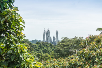 Naklejka premium Modern city and green forest in spring day